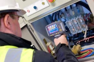 Electrical Engineering Definition Branches And Scope   An Electrical Maintenance Engineer Inspecting The Control Panel Using Thermal Imaging Camera 300x200 